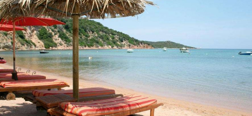 Pampelonne beach in Saint-Tropez with private concession umbrellas and Mediterranean shoreline