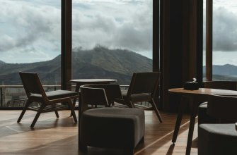 Mountain-view restaurant interior with wooden chairs and dining tables