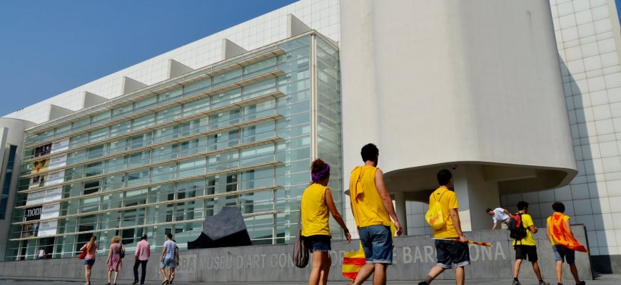 The white facade of the MACBA contemporary art museum and its plaza in Barcelona