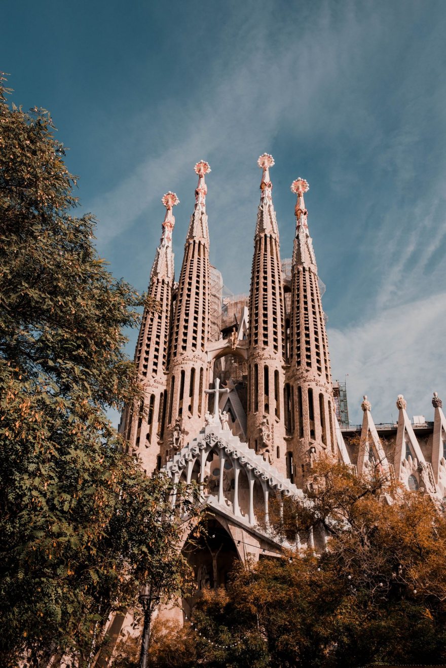 The spires of the Sagrada Familia against a blue Barcelona sky