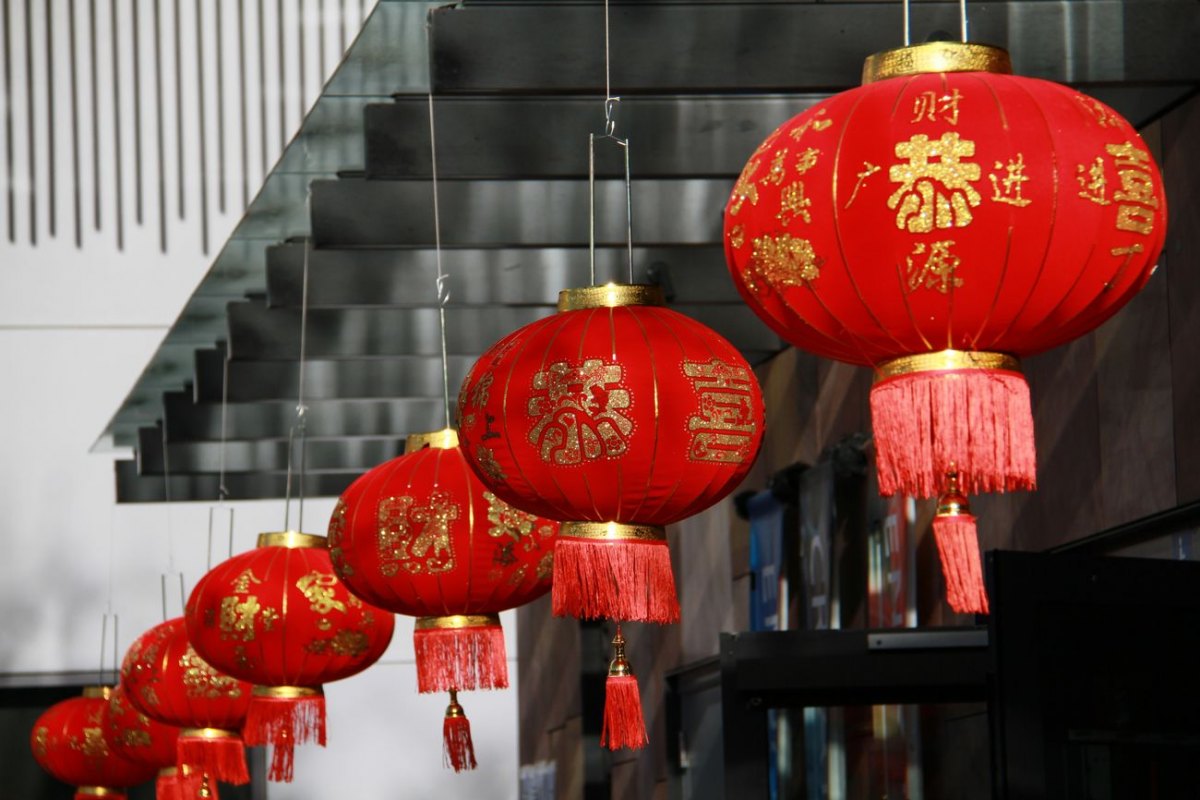 Red Chinese lanterns with gold characters hung for the lunar New Year