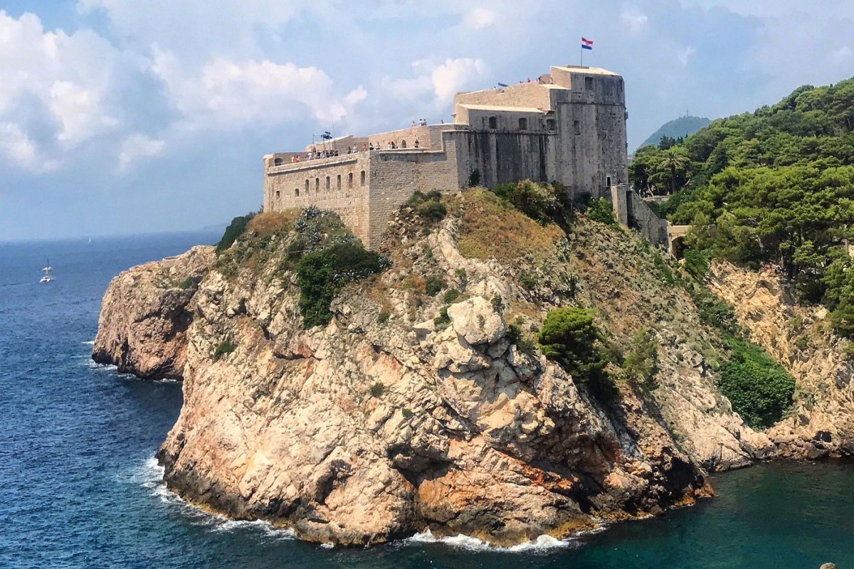 Fort Lovrijenac on a rocky cliff in Dubrovnik against a blue sky