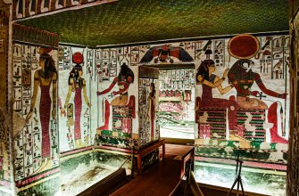 A New Kingdom Egyptian tomb chamber painted with seated gods and hieroglyphs
