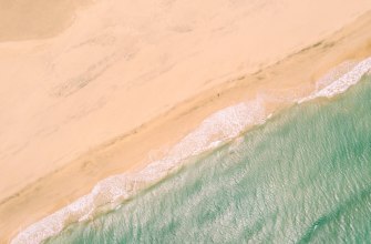 Shallow turquoise lagoon and white sand at El Cotillo, Fuerteventura