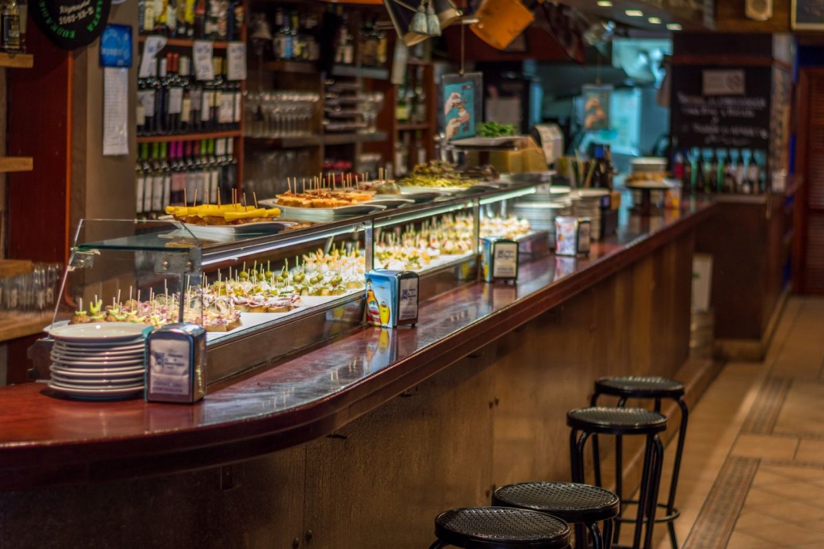 A counter of pintxos and tapas on display at a bar in Barcelona