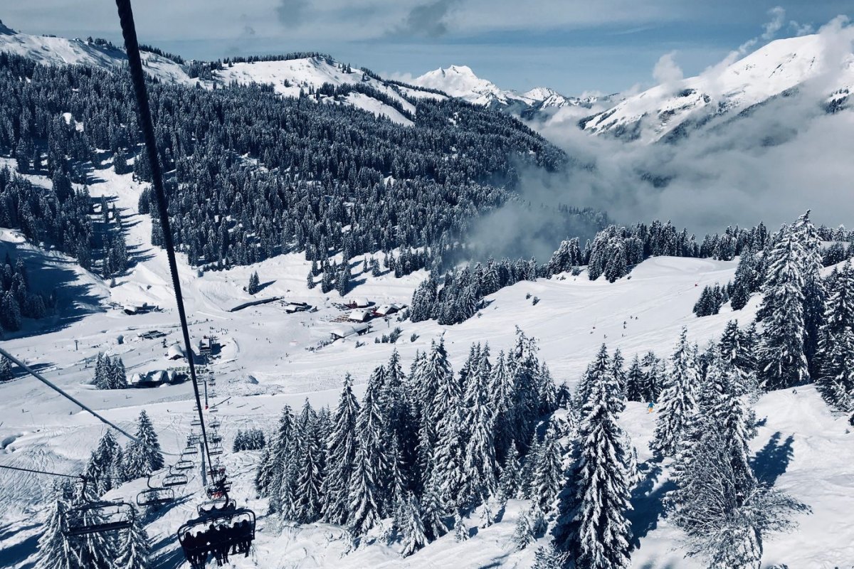 A chairlift over the pistes of a French Alps ski resort