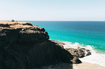 Turquoise Atlantic water and rocky beach in Fuerteventura