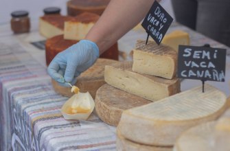 A market stall with artisanal cheese and local produce