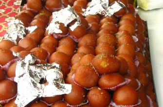 Gulab jamun, soft brown milk dumplings soaked in rose sugar syrup