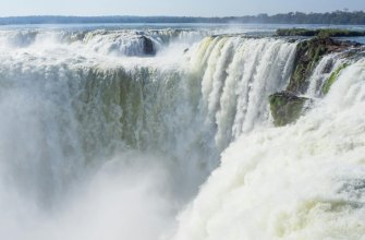 Powerful cascades of the Iguazu Falls plunging into mist in Argentina
