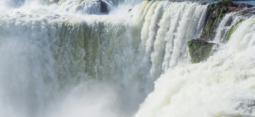 Powerful cascades of the Iguazu Falls plunging into mist in Argentina