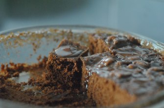 Slices of chocolate biscuit cake studded with biscuit pieces