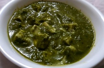 Palak paneer, soft paneer cubes in a bright green spinach gravy