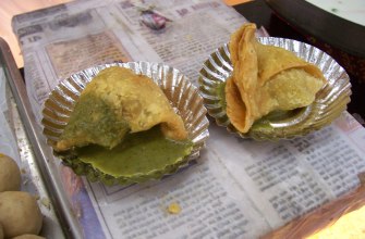 Crisp triangular Indian samosas with a flaky golden crust