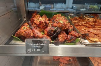 Tandoori chicken pieces stained red with Kashmiri chili and charred